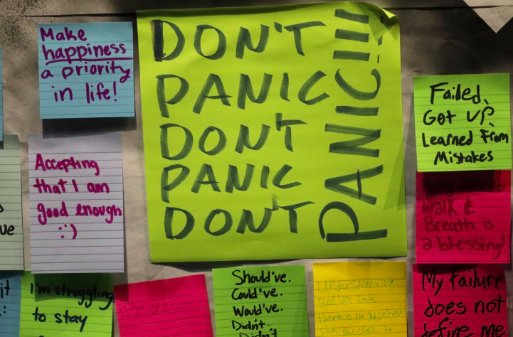 A board covered in colourful post-it notes from a training session with handwritten statements saying things like "Don't Panic", "Make happiness a priority in life", "Accepting that I am good enough" and "Failed, got up and learned from mistakes"